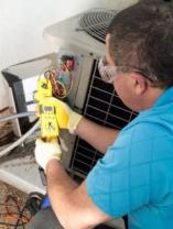 one of our Arvada air conditioning repair techs is fixing an unit