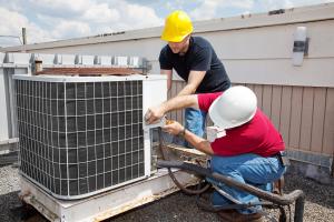 Avada HVAC repair techs working on air conditioning condensor