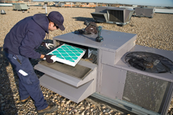 Arvada HVAC repair and installation technician changes air filter